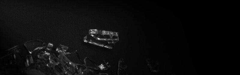 shattered glass on black surface