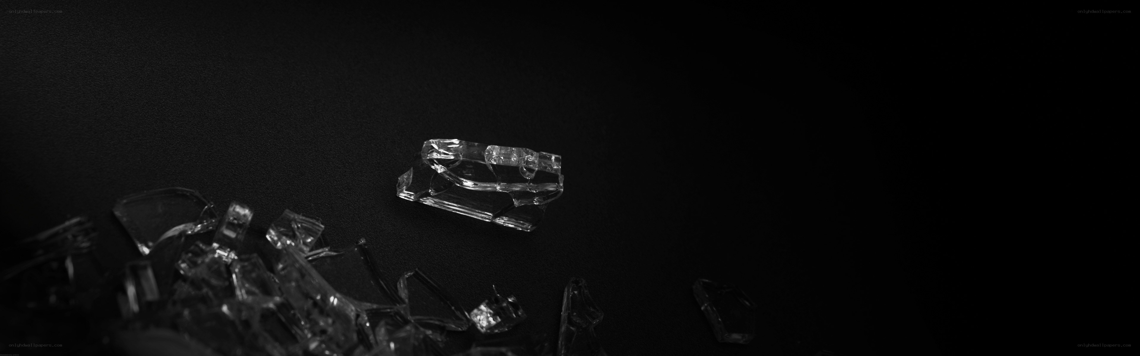 shattered glass on black surface