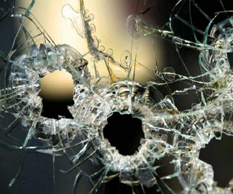 Shattered Glass with Bullet Holes