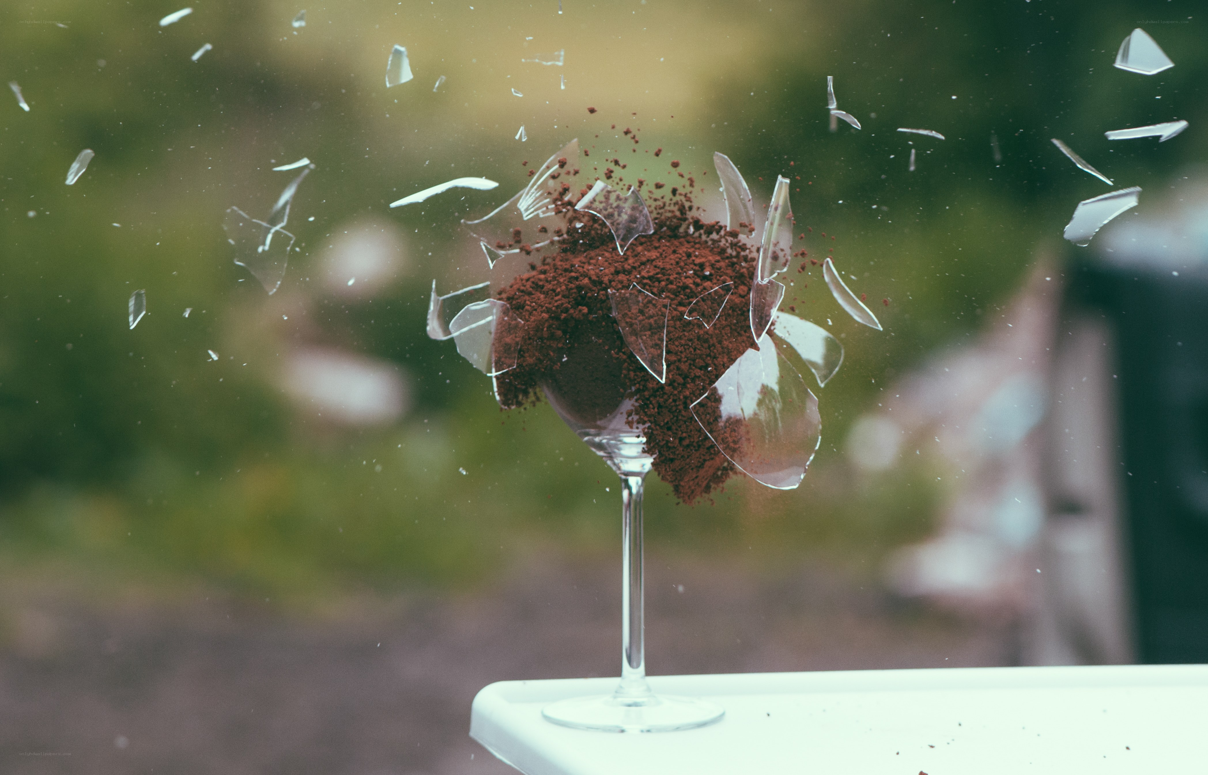 Shattered glass with coffee grounds