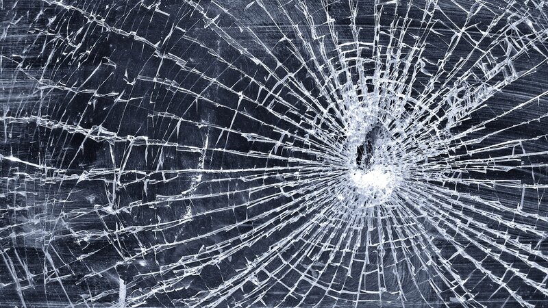 shattered glass with impact point