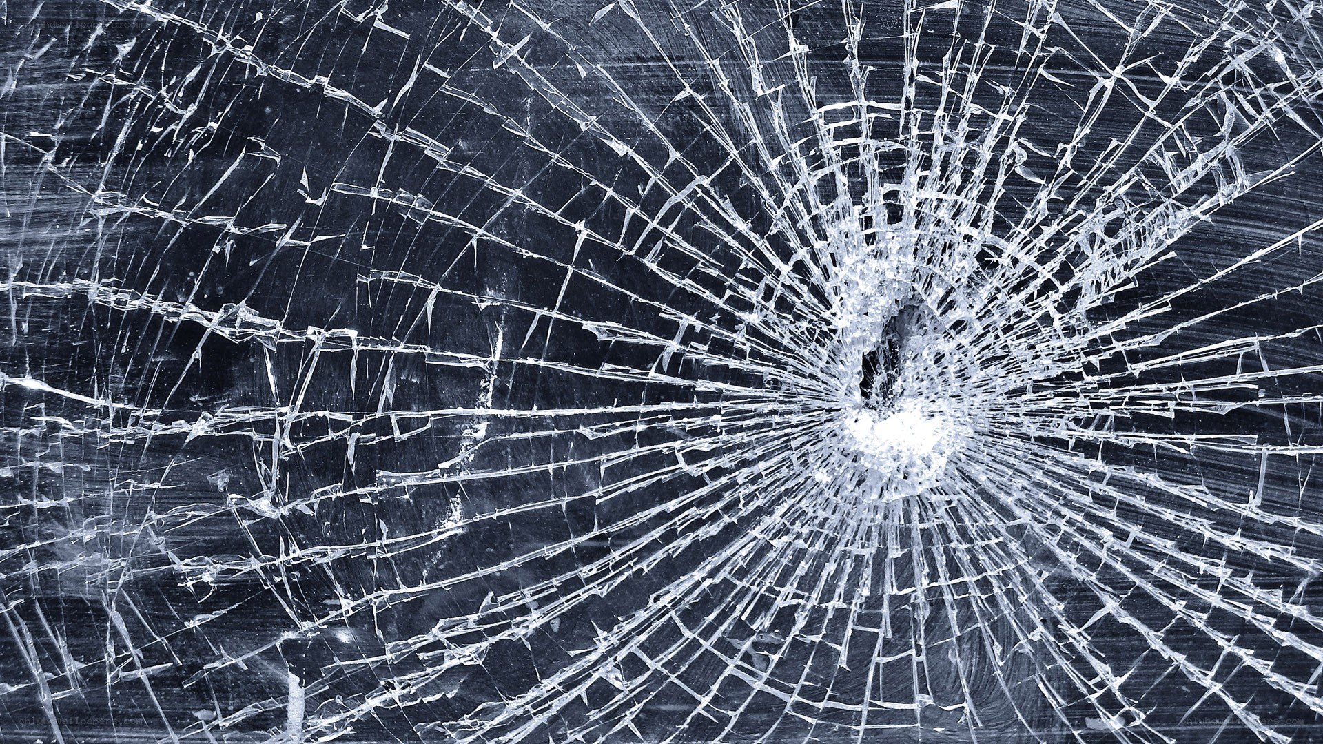 shattered glass with impact point
