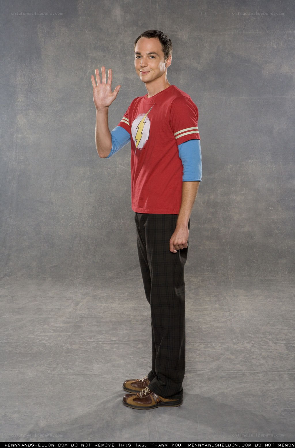 Sheldon waving in Flash shirt
