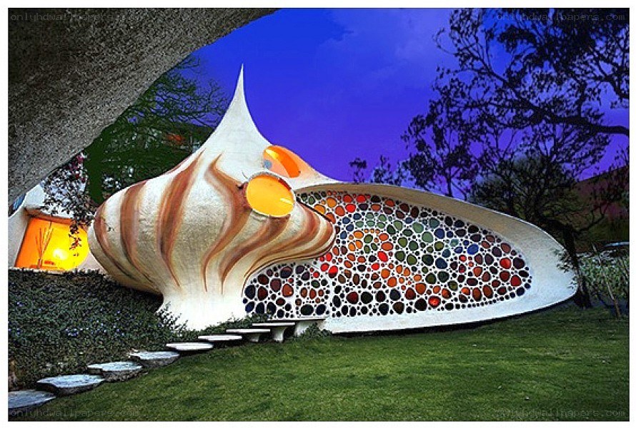 Shell-shaped house at dusk