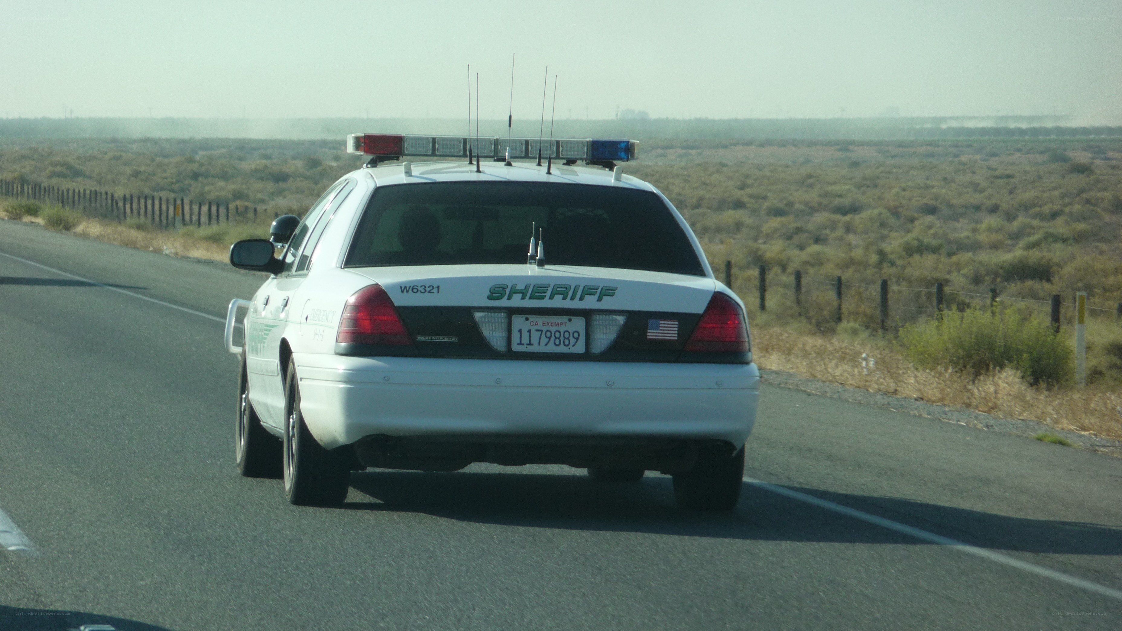 sheriff car on desert road