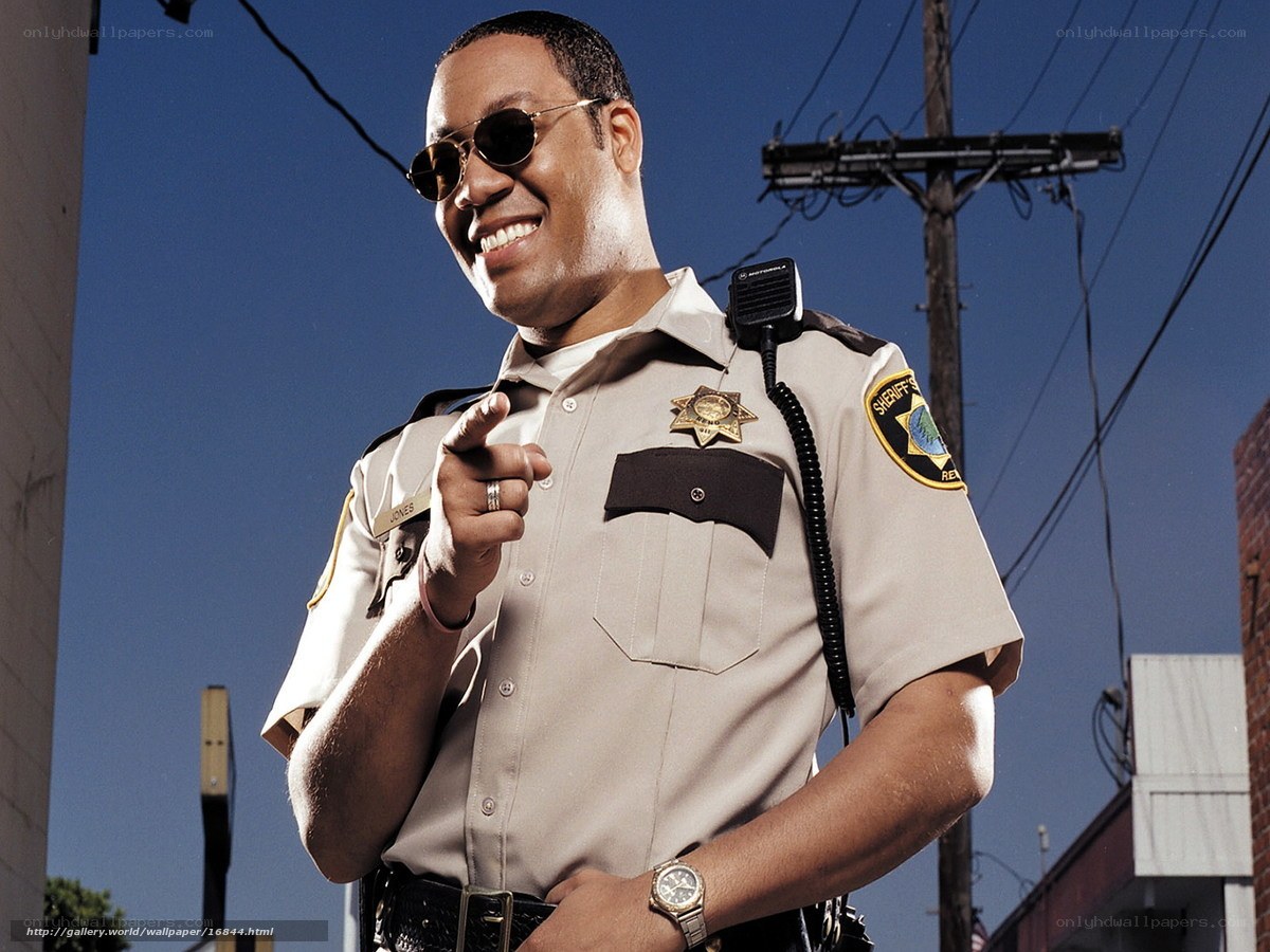 sheriff pointing at camera