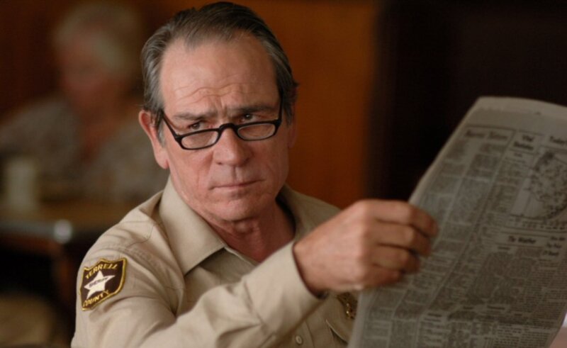 Sheriff reading newspaper
