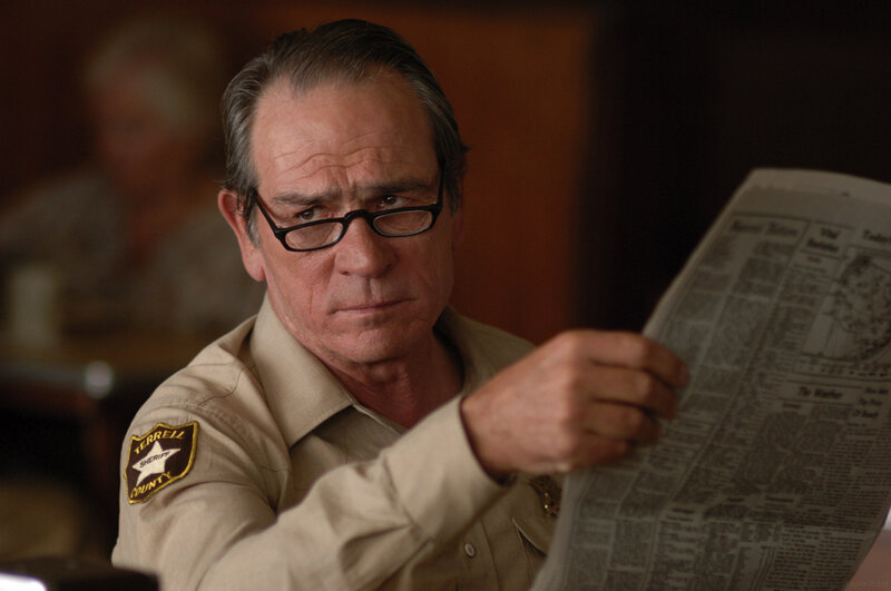 Sheriff reading newspaper