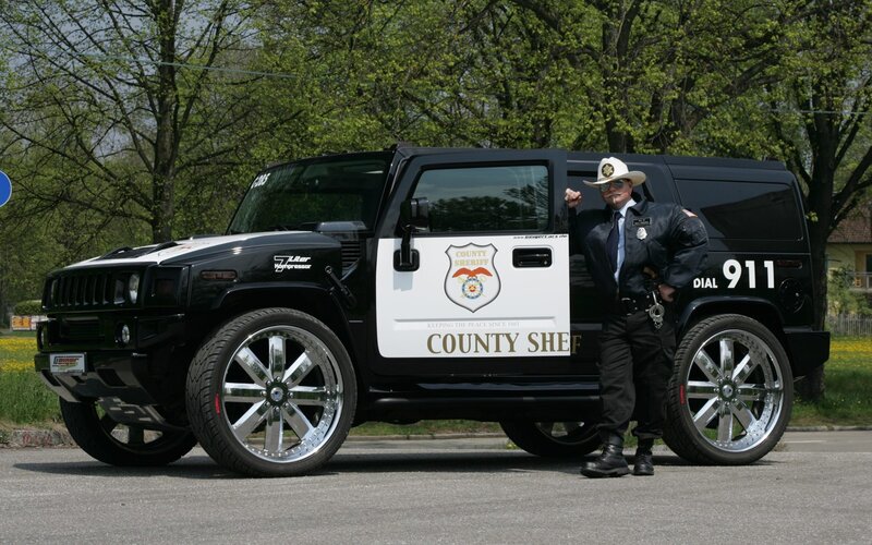 Sheriff Standing by Vehicle — Black
