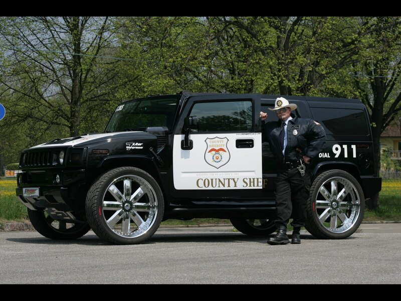 Sheriff Standing by Vehicle