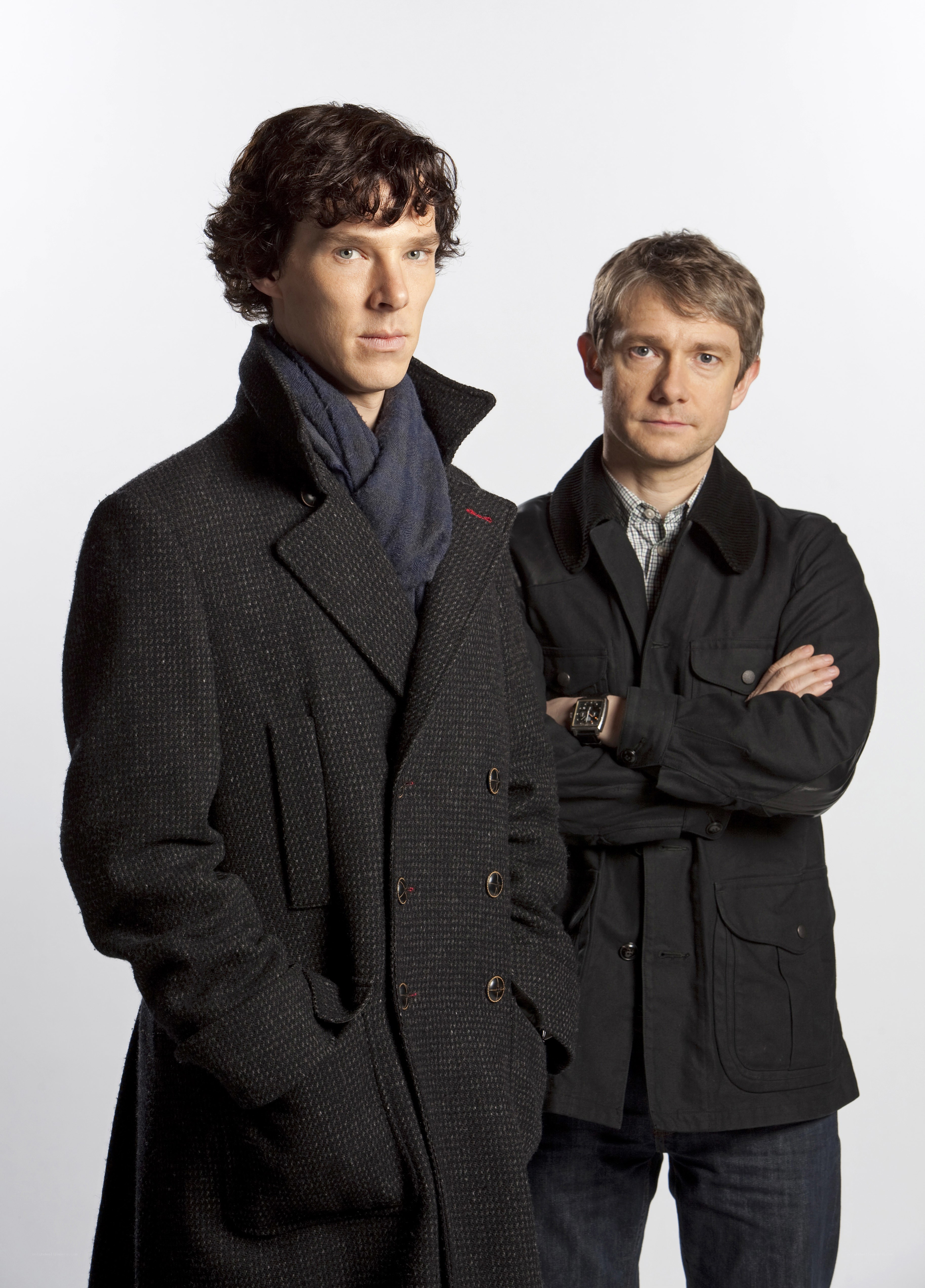 Sherlock and Watson standing together
