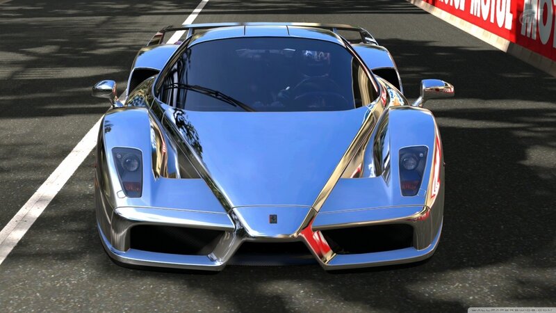 Shiny blue sports car on track