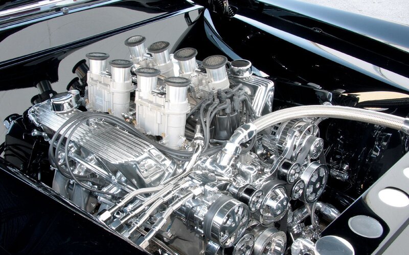 shiny chrome engine in black car