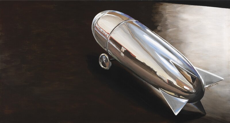 Shiny chrome rocket on dark surface