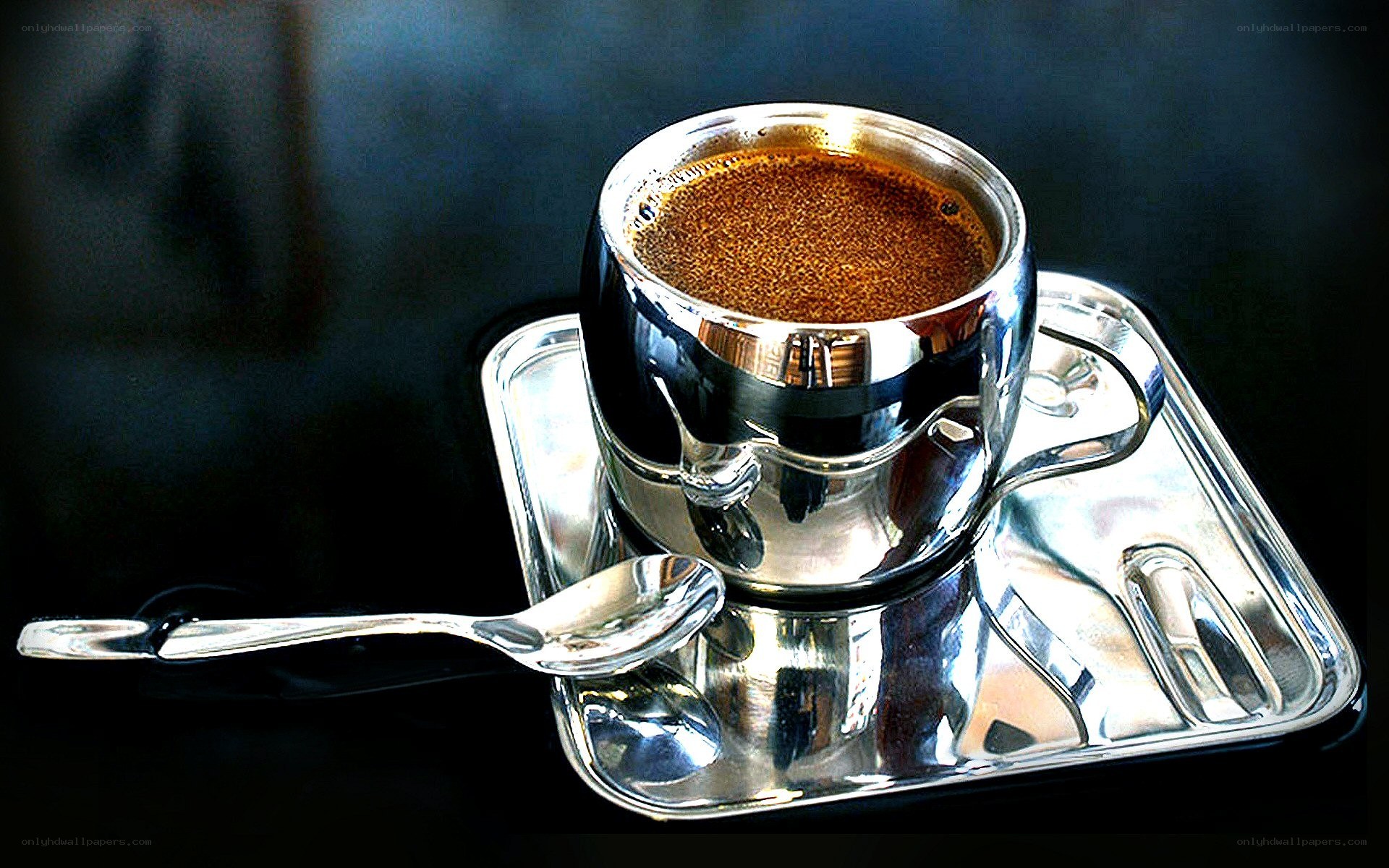 Shiny coffee cup on tray