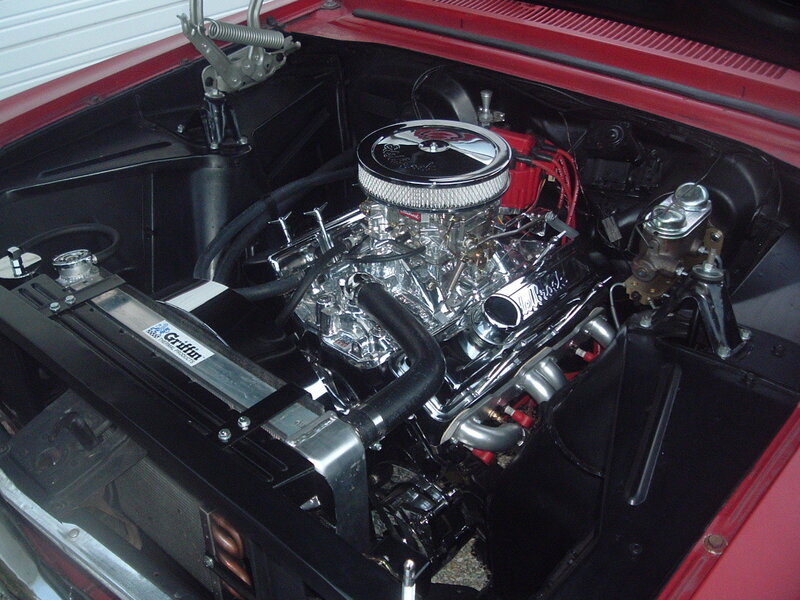 shiny engine in red car