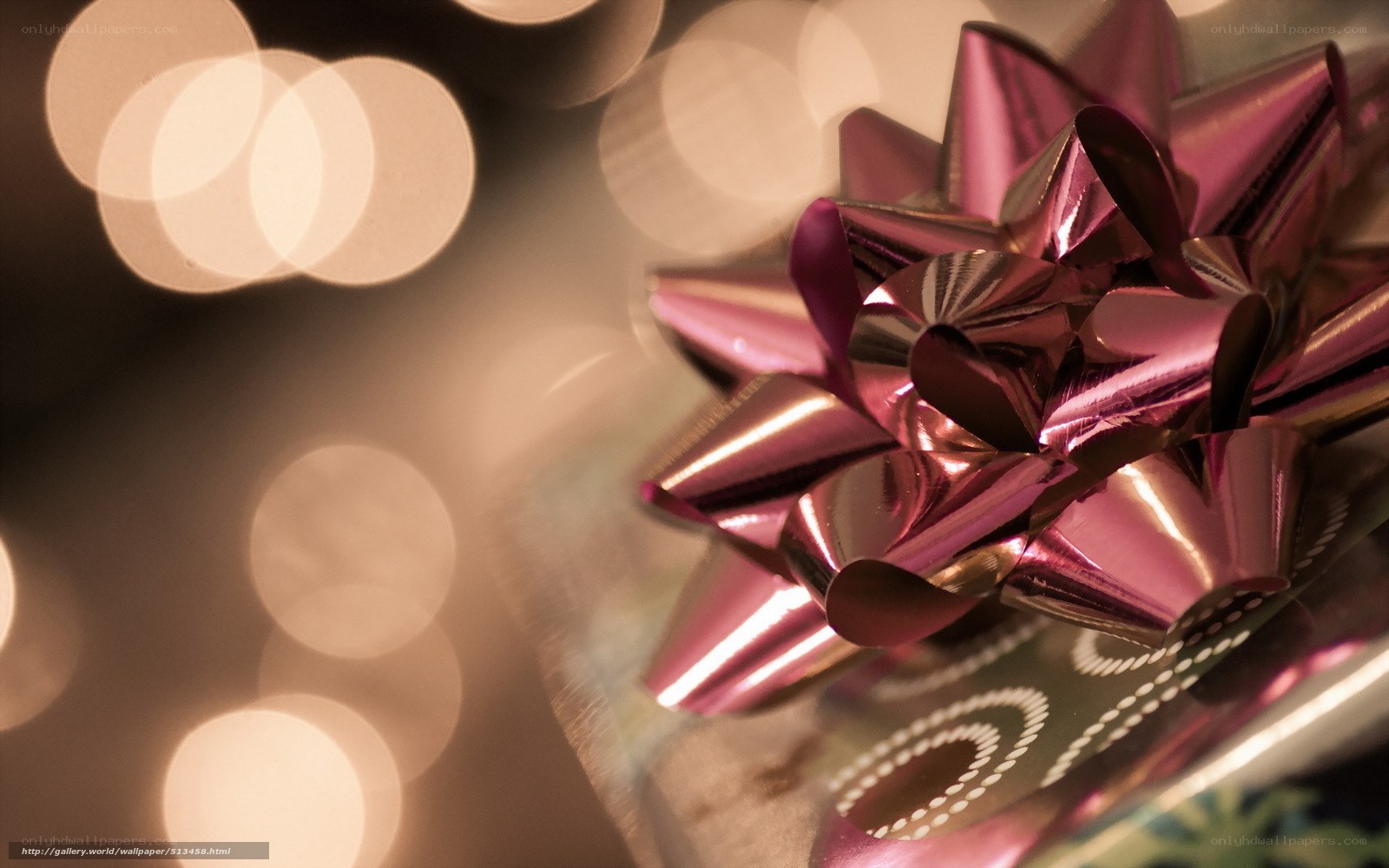 Shiny gift bow with bokeh lights