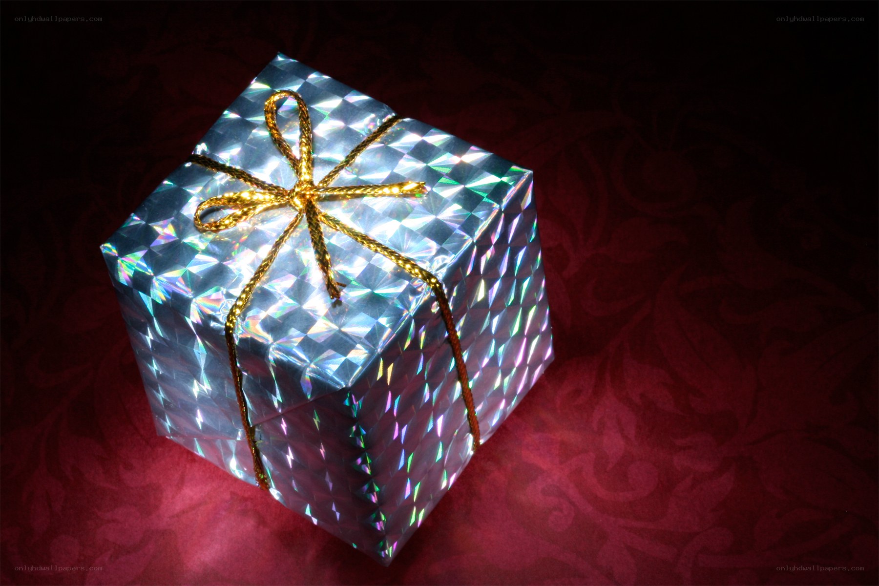 shiny gift box with gold bow