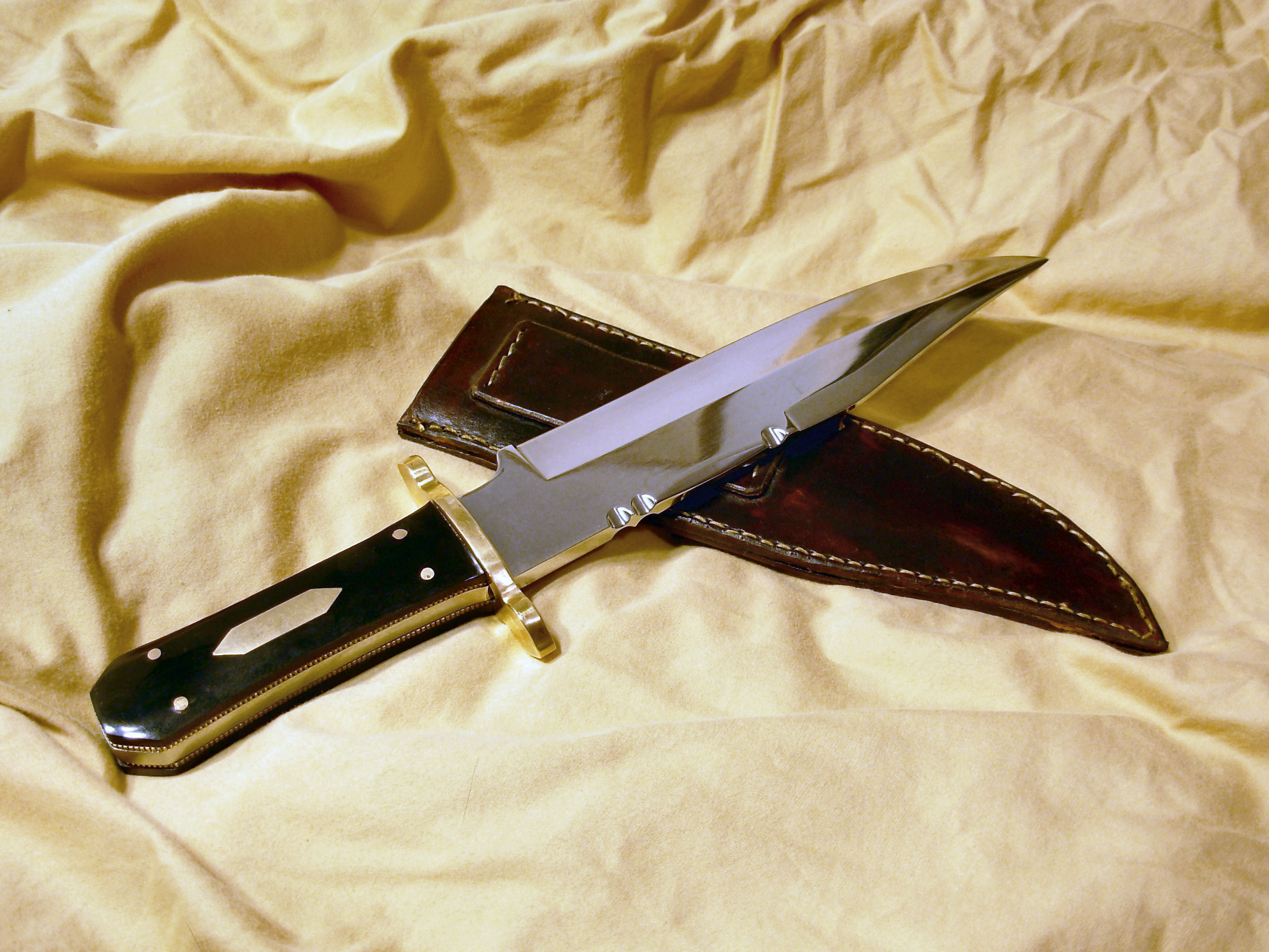 shiny knife with leather sheath