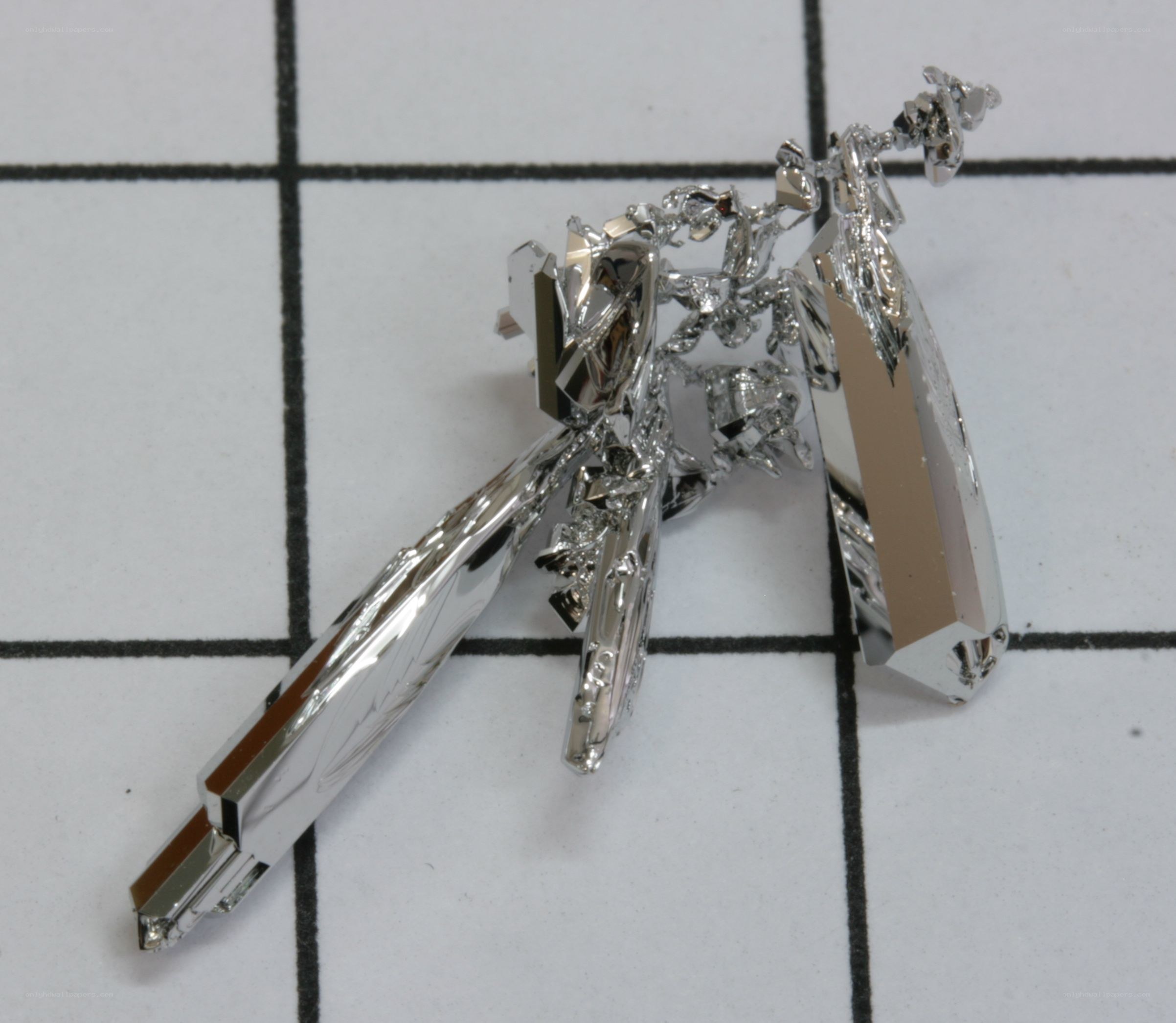 shiny metal crystals on grid