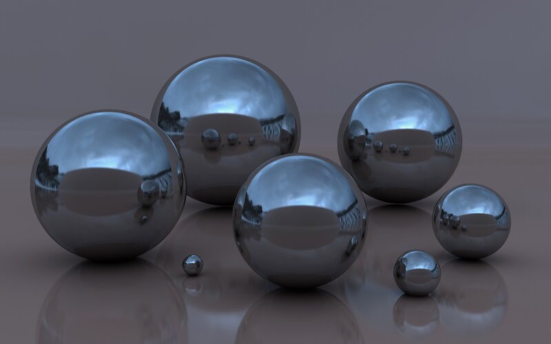Shiny metal spheres on reflective surface