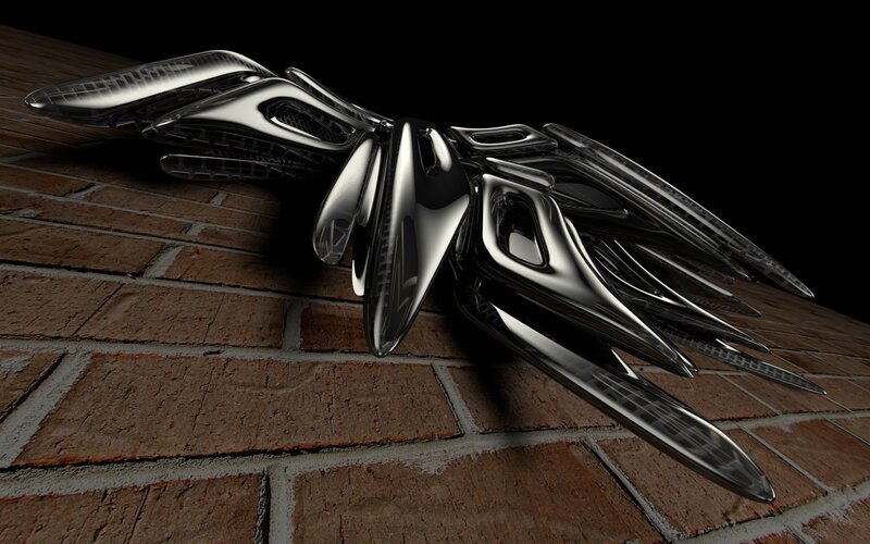shiny metallic sculpture on brick