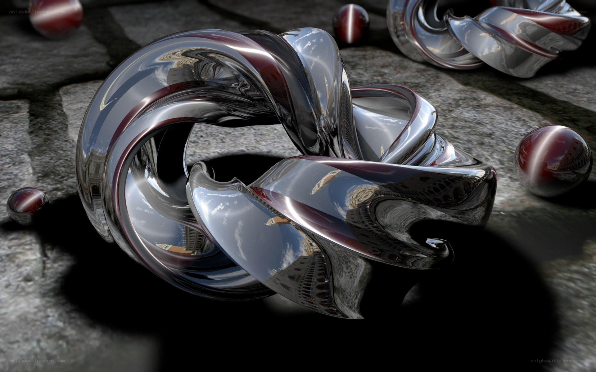 Shiny metallic sculpture on stone