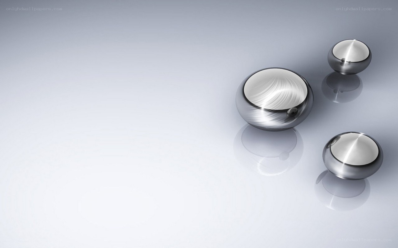 Shiny metallic spheres on reflective surface
