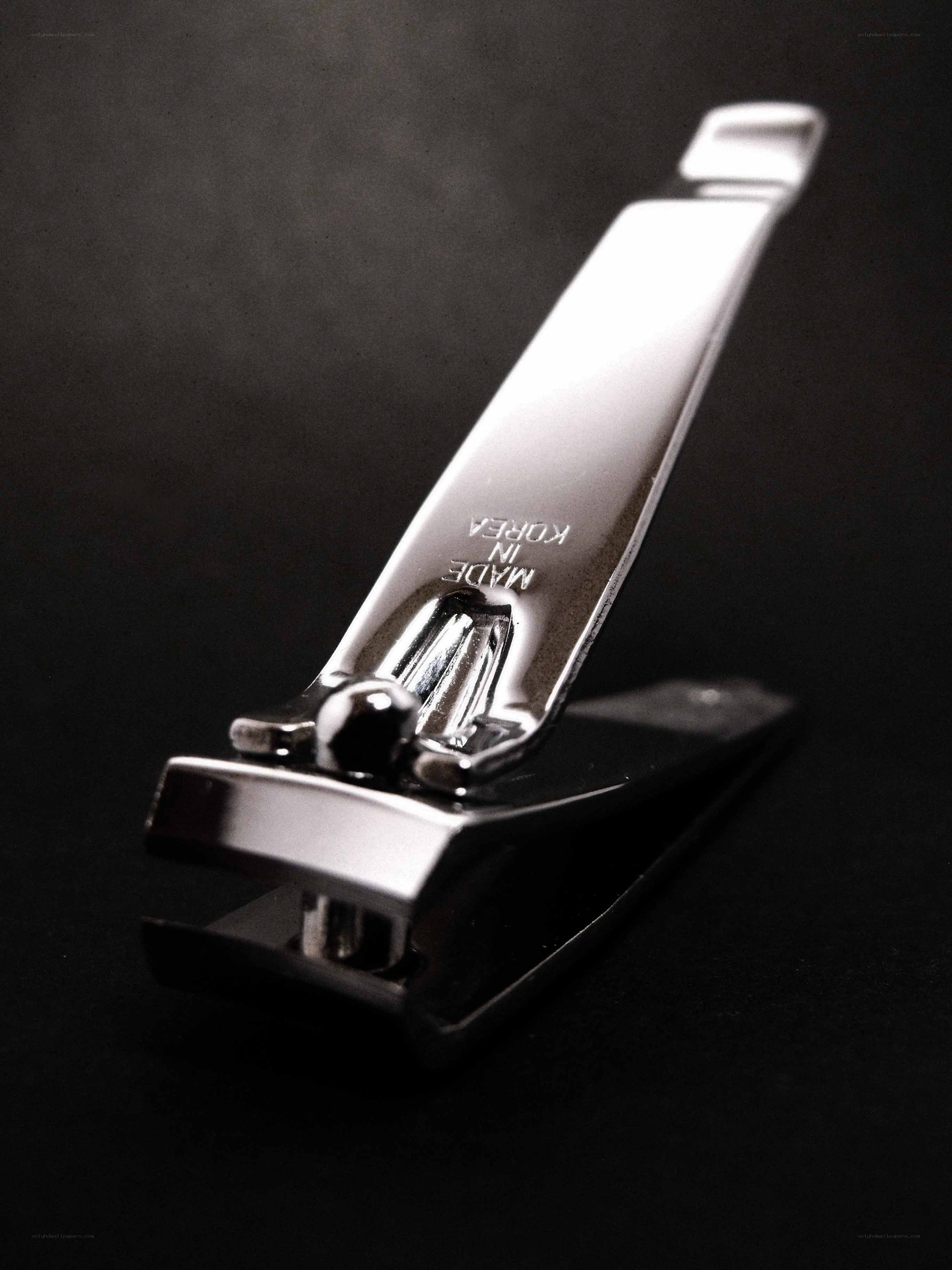 shiny nail clipper on black