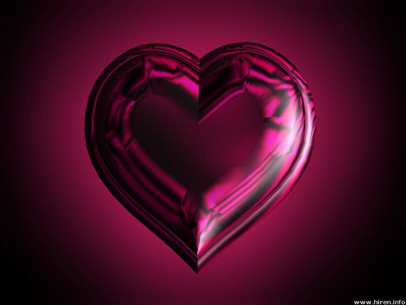 Shiny pink heart on dark background