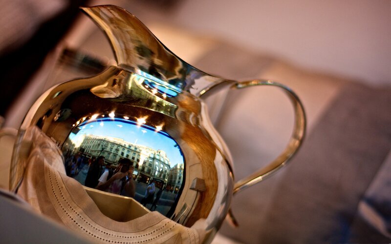 Shiny pitcher reflecting a city street