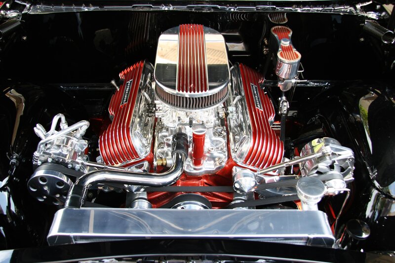 shiny red engine in car