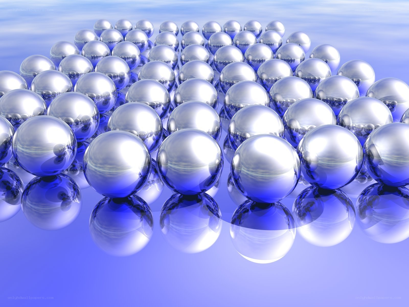 shiny silver spheres on blue