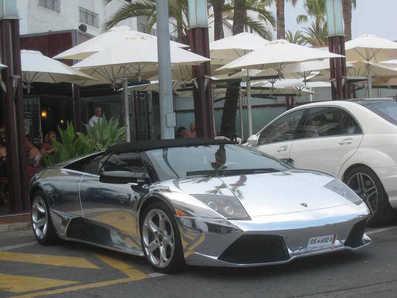 Shiny silver sports car on street