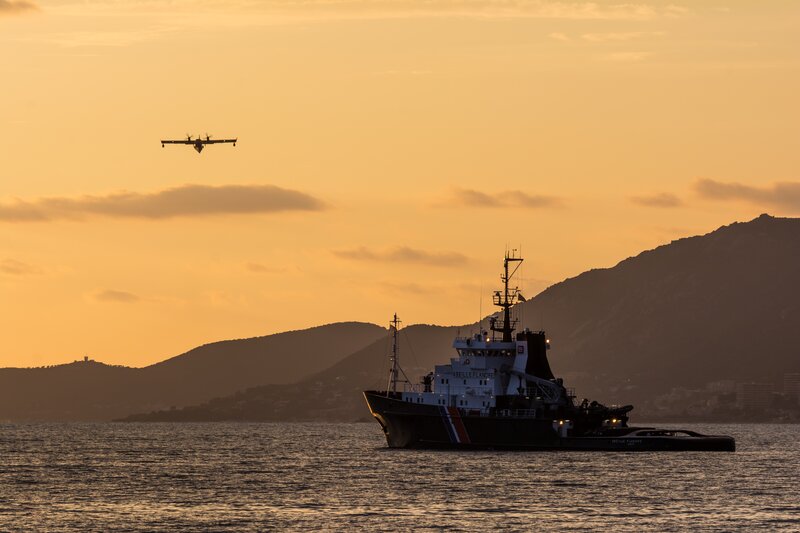 Ship and Airplane at Sunset