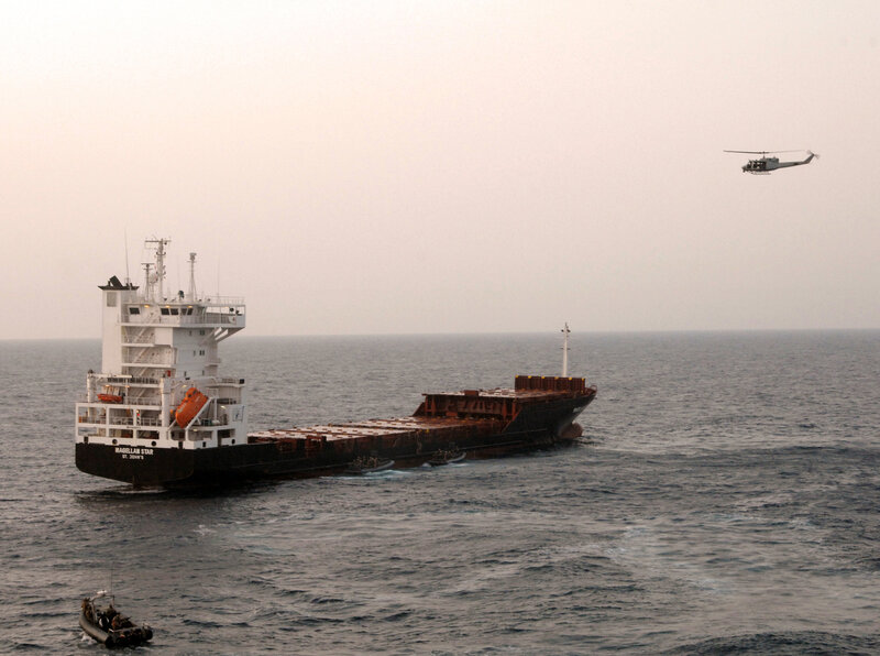 Ship and helicopter at sea