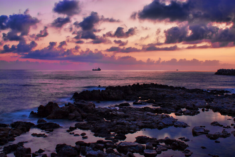 Ship at Sea During Sunset — Purple
