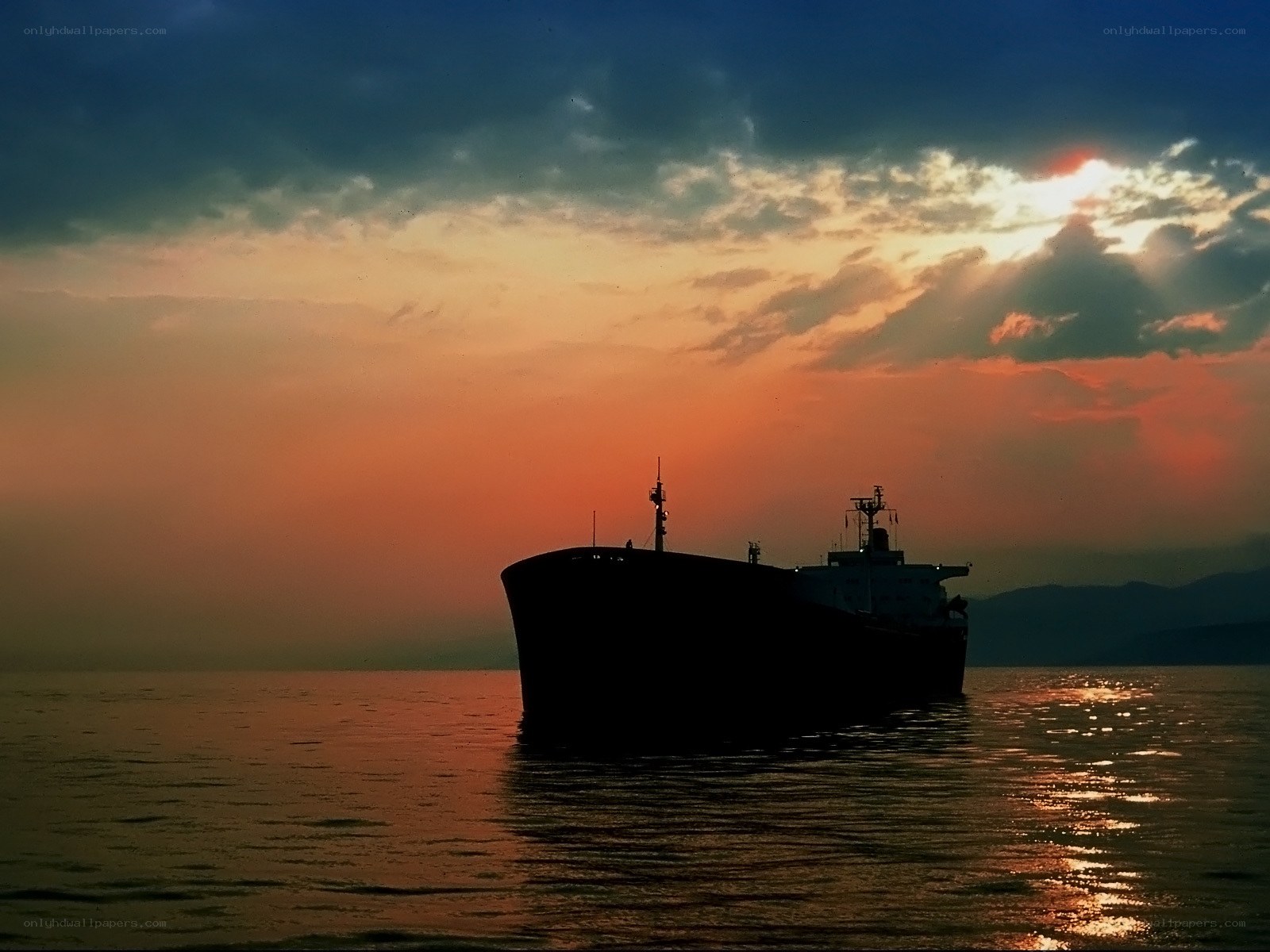 ship at sunset on calm sea