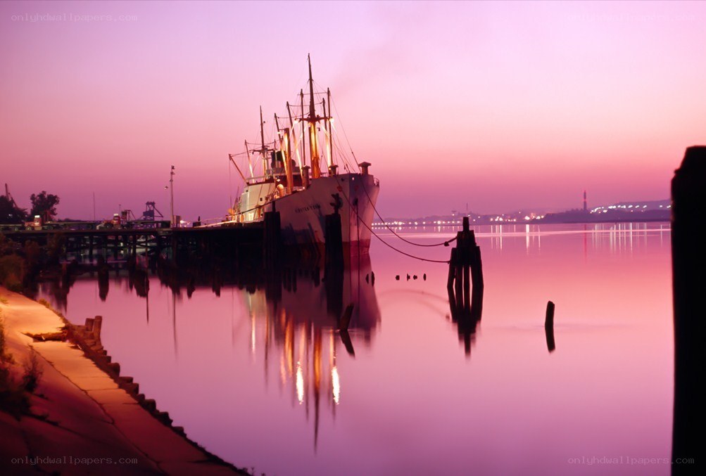 ship at sunset on calm water