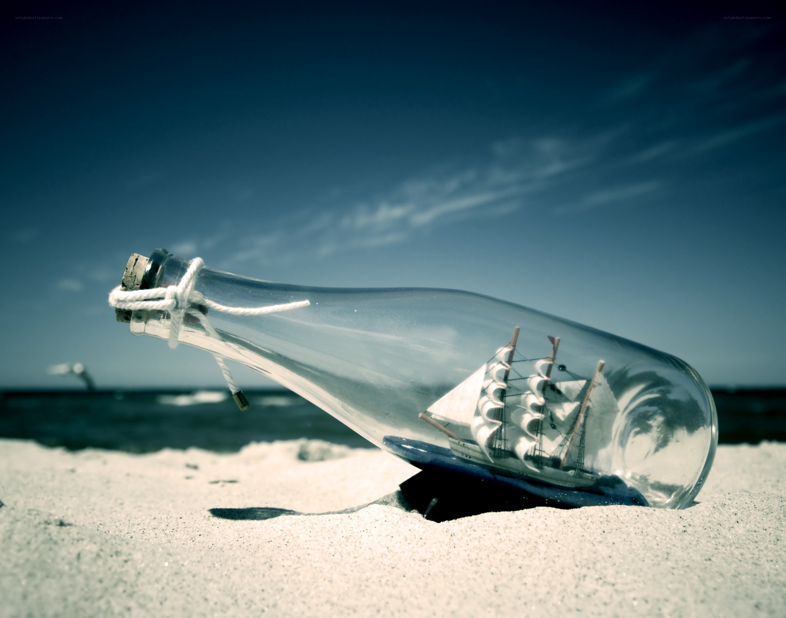Ship in a bottle on the beach