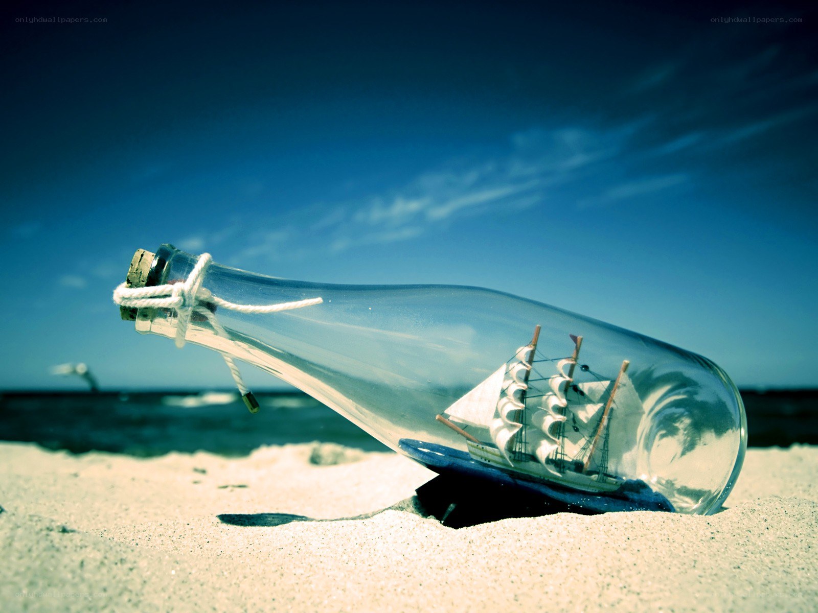 Ship in a bottle on the beach