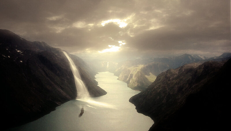 ship in a fjord at sunset