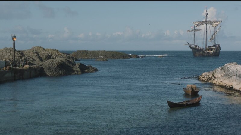 ship in a rocky harbor