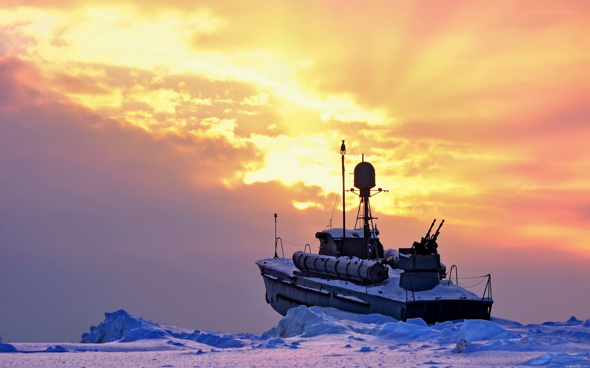 ship in arctic ice at sunset