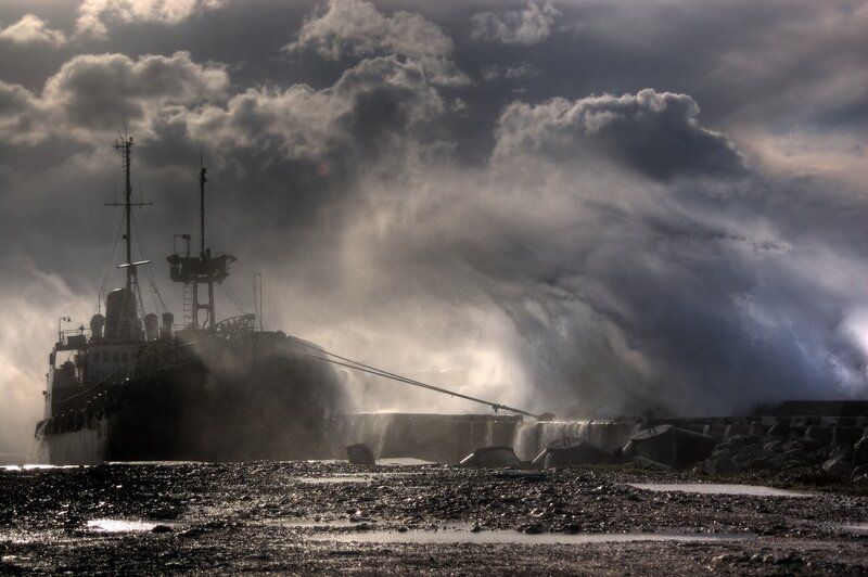 Ship in stormy harbor