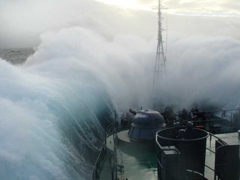 Ship in Stormy Sea — Blue, Dramatic, Sunset