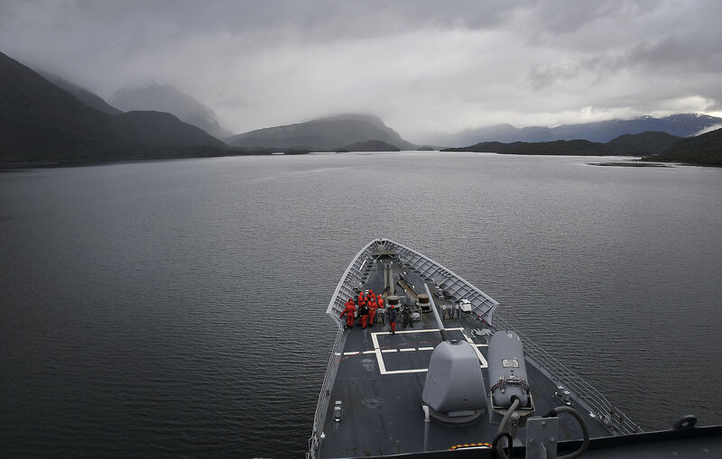 Ship navigating a fjord