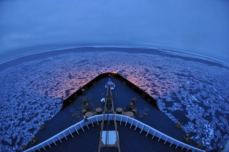 ship navigating ice floes