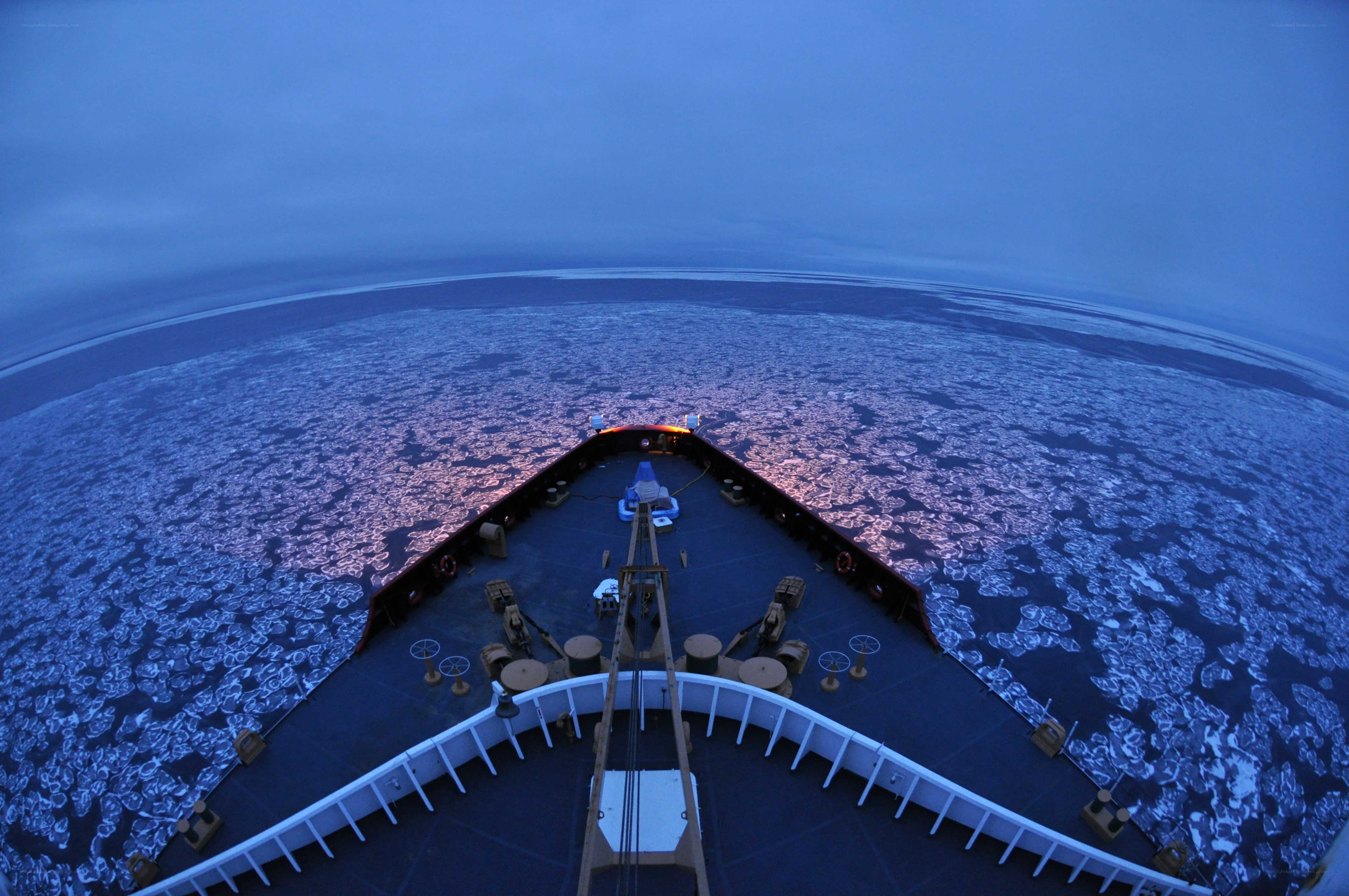 ship navigating ice floes