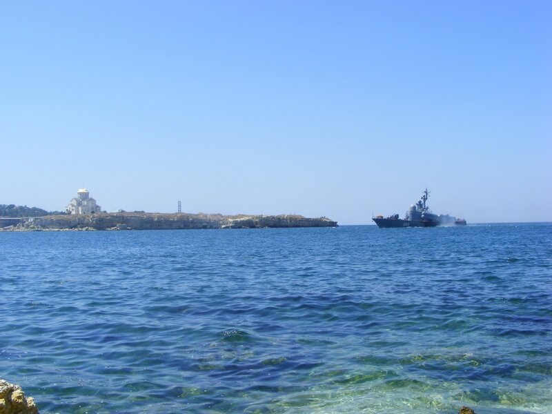Ship near coastal church